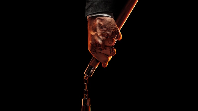 John Wick from John Wick Chapter 4 holding nunchucks