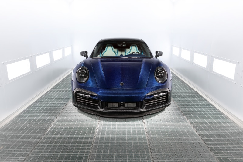 Porsche 911 Turbo S in a car painting booth