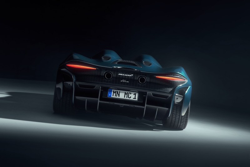 Rear view of a blue McLaren Elva sports car