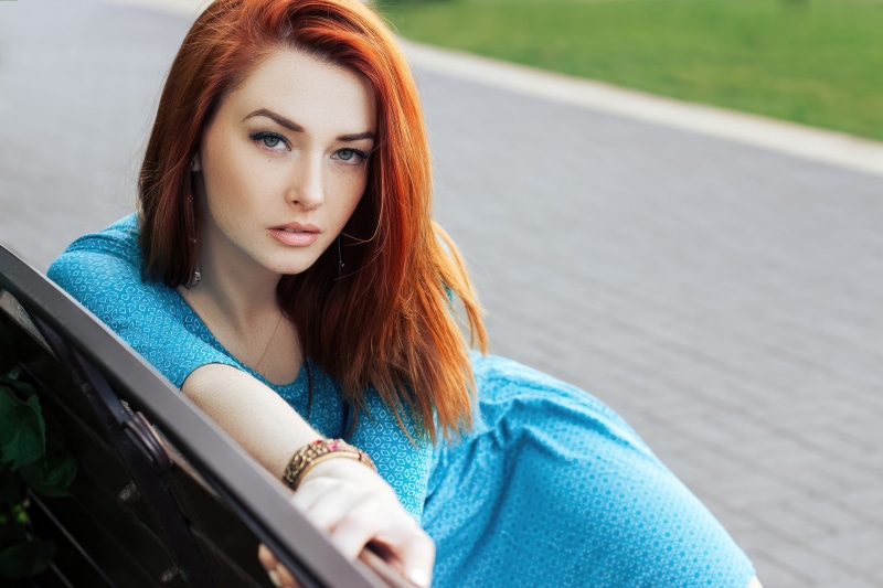 Redhead woman in blue dress
