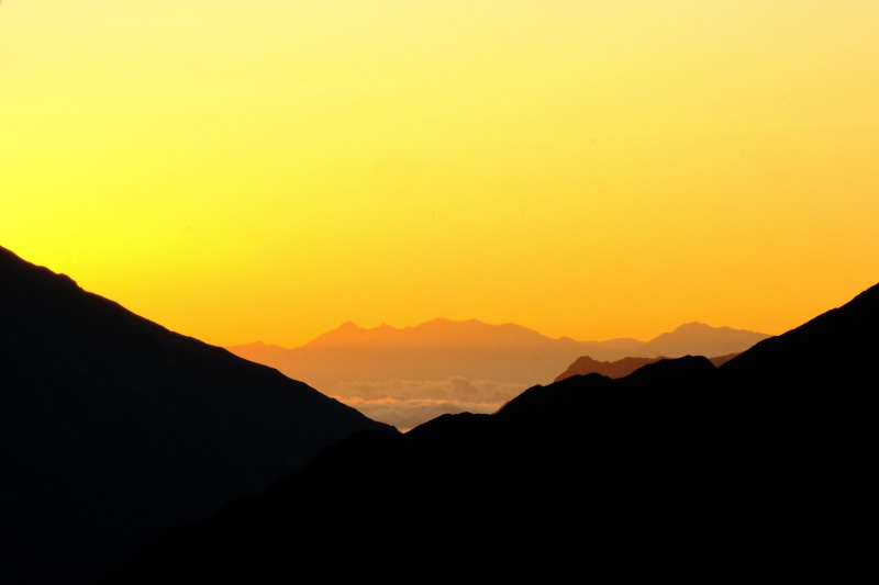 Mountain range silhouette at sunset