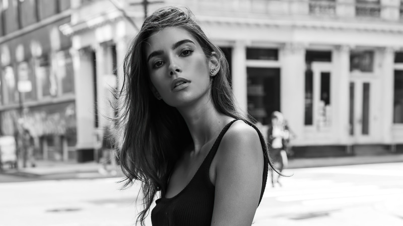 Cindy Mello in black tank top on city street