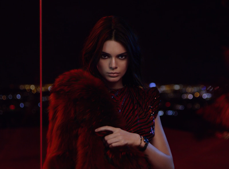 Kendall Jenner in a red fur coat at night