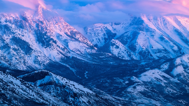 Snow-covered mountains at sunrise