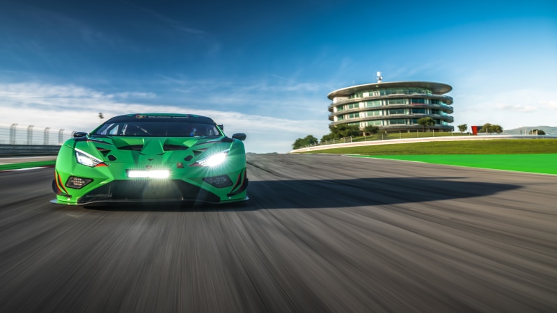 Green Lamborghini Huracan GT3 race car on track