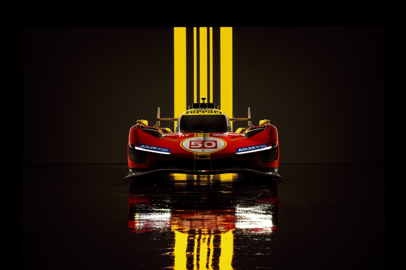 Ferrari 499P race car with yellow stripes