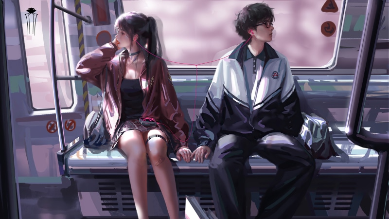 Couple sharing earphones on a train