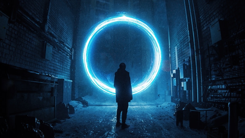 Man standing before a glowing blue portal in a dark alley
