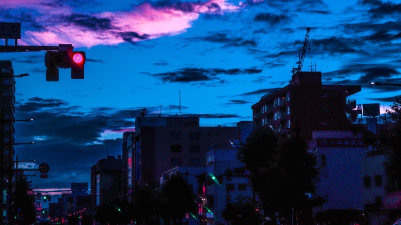 City street at dusk with traffic lights