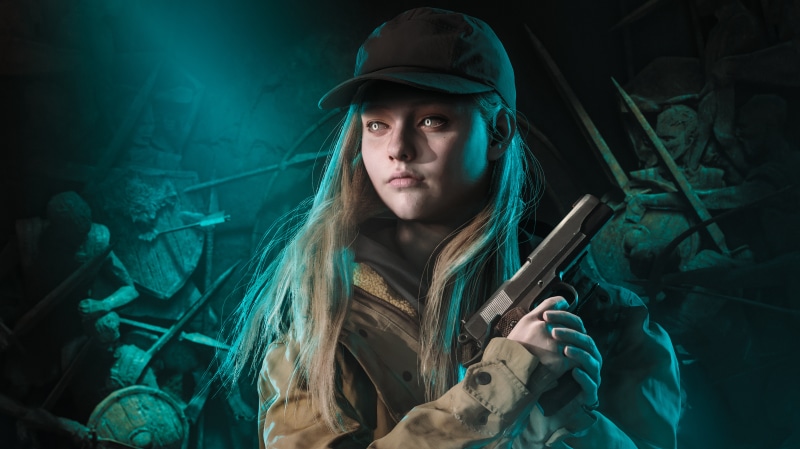 Rose Winters from Resident Evil holding a pistol