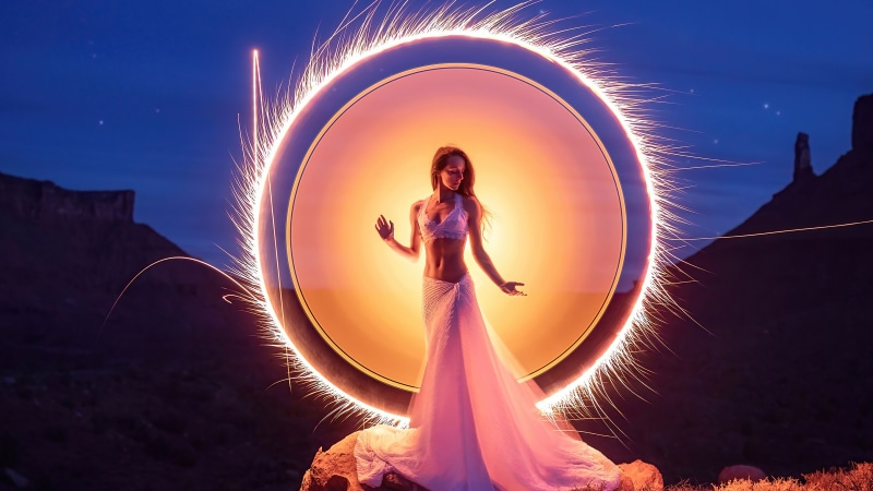 Woman in a white dress in a fiery portal