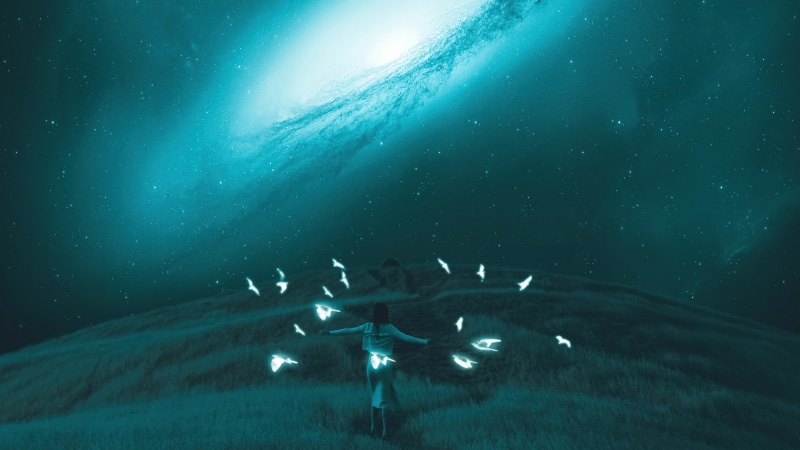 Digital art of a person with glowing birds under a galaxy