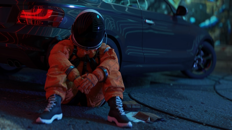 Astronaut sitting next to a car