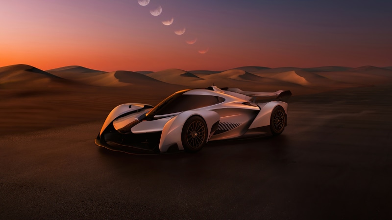 McLaren Solus GT in a desert landscape at sunset