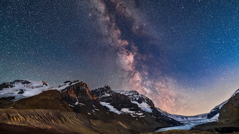 Milky Way over snow-capped mountains