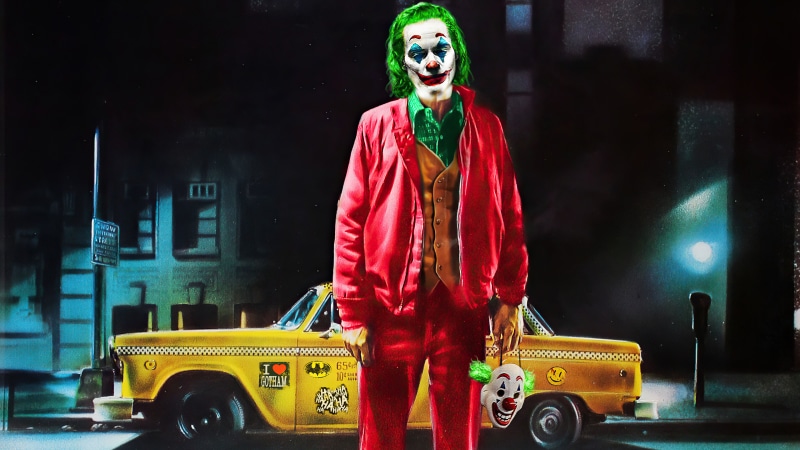 Joker standing by a yellow taxi