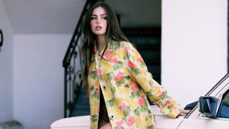 Addison Rae in floral jacket by a car