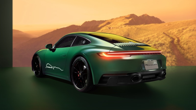 Green Porsche 911 Carrera GTS in mountains