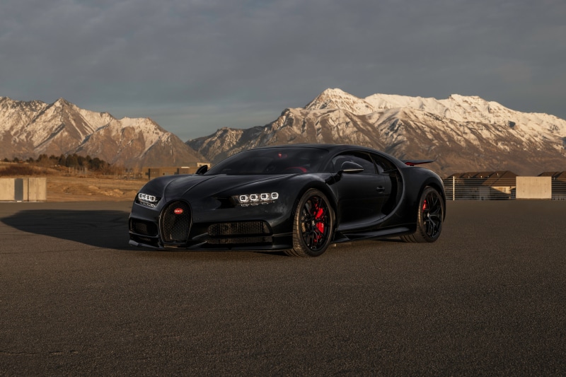 Black Bugatti Chiron with Snowy Mountains