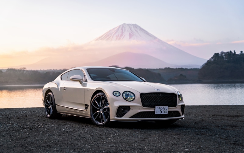Bentley Continental GT parked by a lake with Mount Fuji