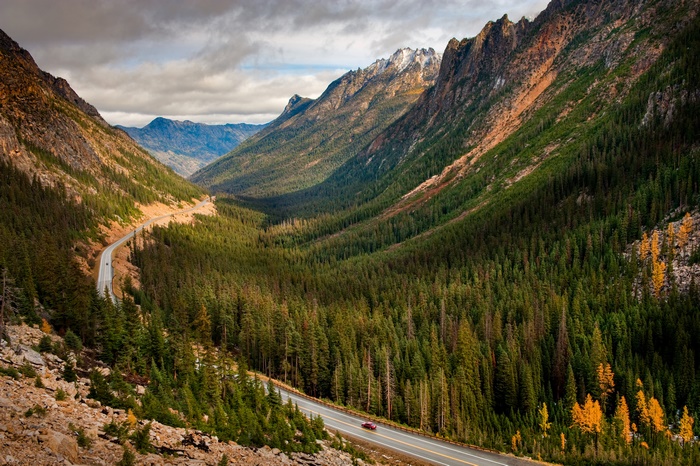 Winding Road through a Mountain Forest Valley