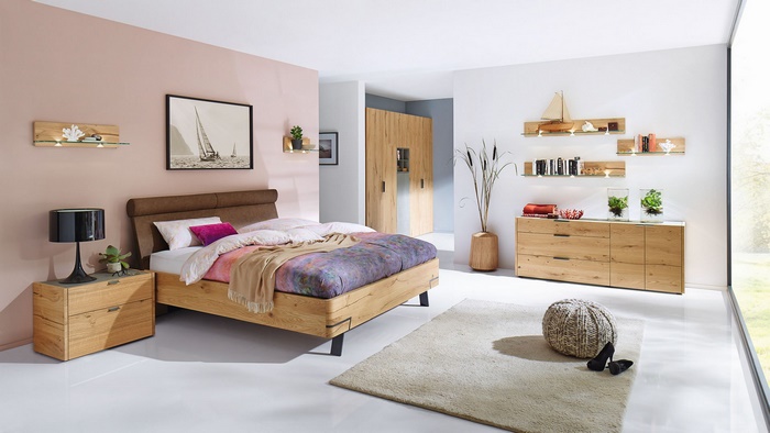 Modern bedroom with light wood furniture and decor
