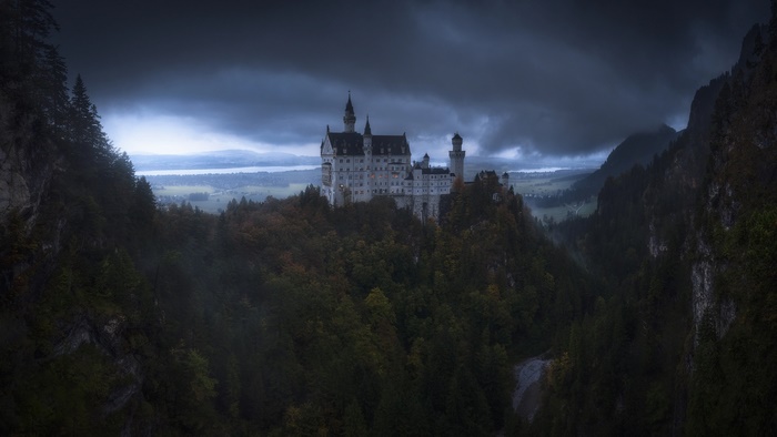 Dark and moody Neuschwanstein Castle in the German mountains