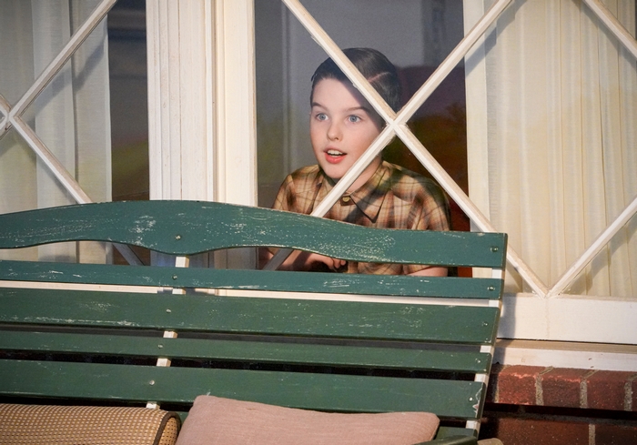 Young Sheldon Cooper looks out window with surprise