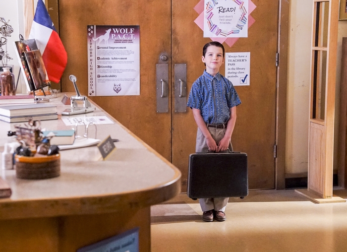 Young Sheldon Cooper holding briefcase at school