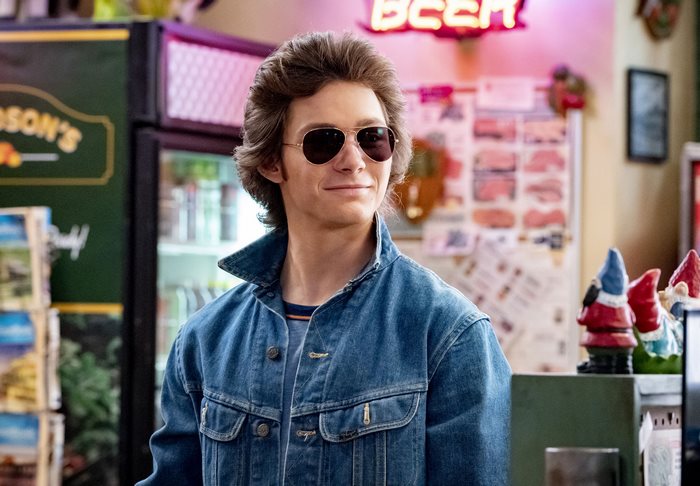 George Cooper Jr. smiling in sunglasses and denim jacket