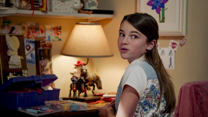 Missy Cooper looking surprised at her desk