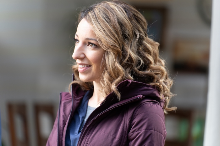 Vanessa Lengies smiling in a purple jacket