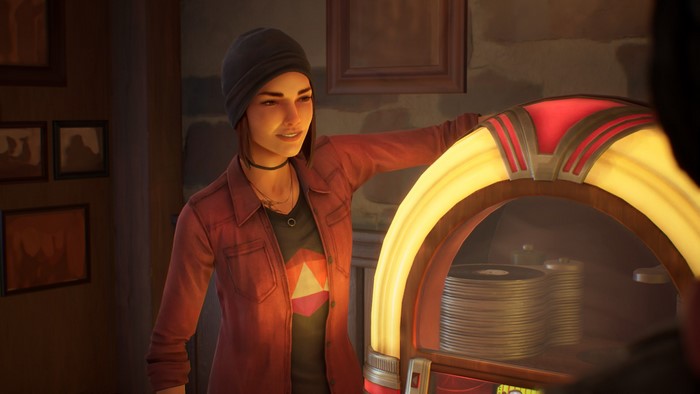 Steph Gingrich smiling by a jukebox in Life Is Strange: True Colors