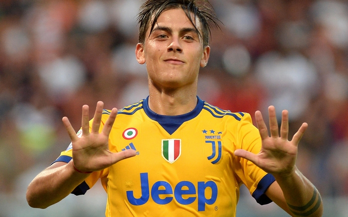 Paulo Dybala smiling in Juventus F.C. yellow kit