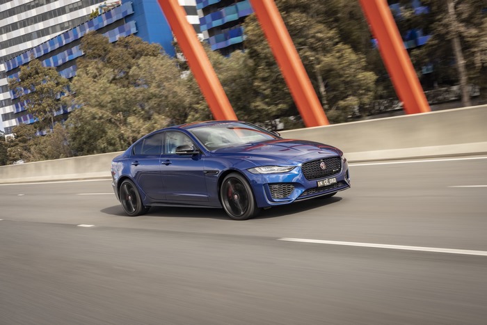 Blue Jaguar XE P300 AWD Luxury Sedan Driving