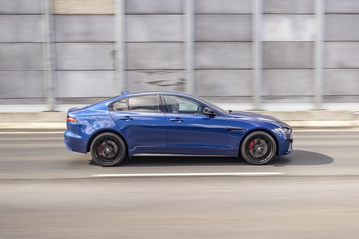 Moving Blue Jaguar XE P300 AWD Luxury Car