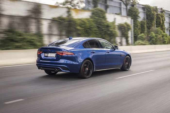 Blue Jaguar XE P300 AWD luxury car on road