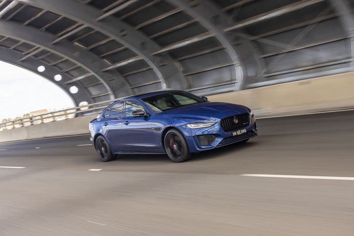Blue Jaguar XE P300 AWD luxury car driving