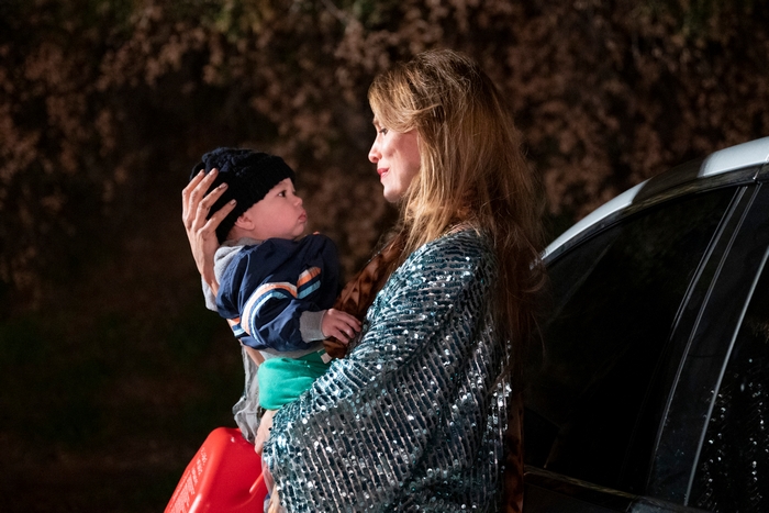 Saffron Burrows holding a baby in You