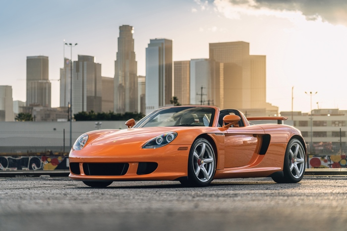 Orange Porsche Carrera GT in Los Angeles at sunset