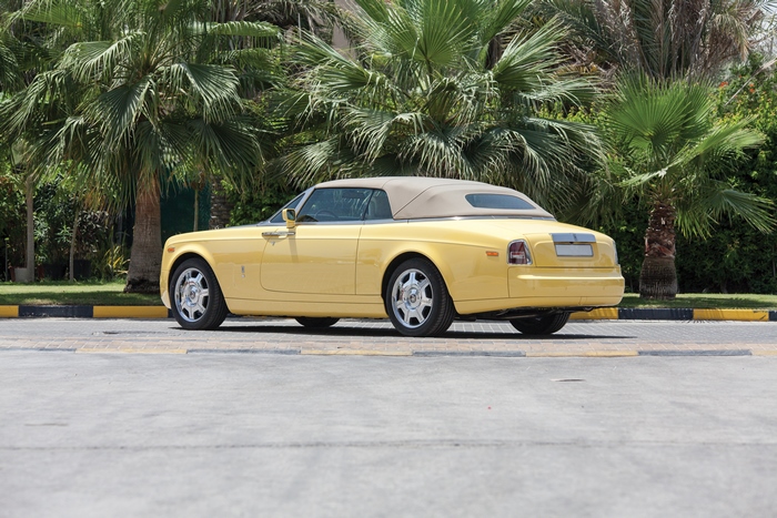 Yellow Rolls-Royce Phantom Convertible with Palm Trees