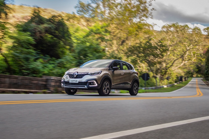 Renault Captur SUV driving on a scenic road