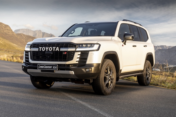 White Toyota Land Cruiser GR-S SUV on mountain road