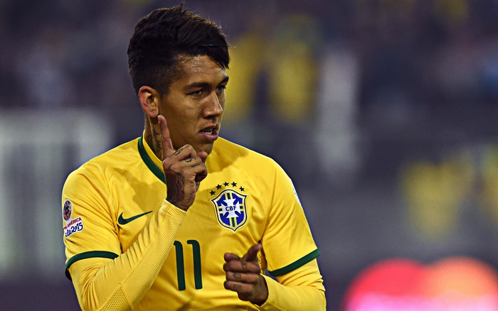 Roberto Firmino shushing in Brazil football kit