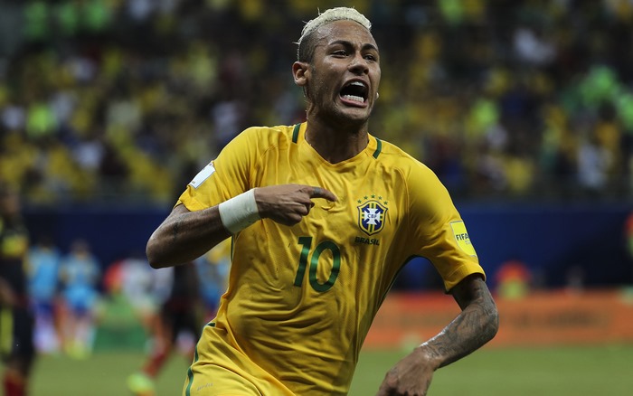 Neymar celebrates in Brazil national football team jersey