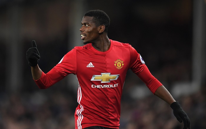Paul Pogba gives thumbs-up in Manchester United kit
