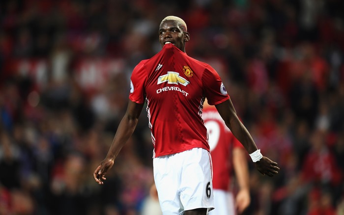 Paul Pogba celebrating in Manchester United soccer jersey