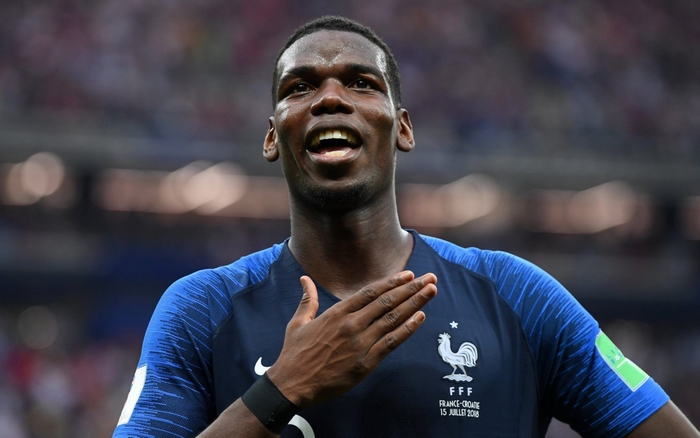 Paul Pogba smiling in France National Football Team jersey