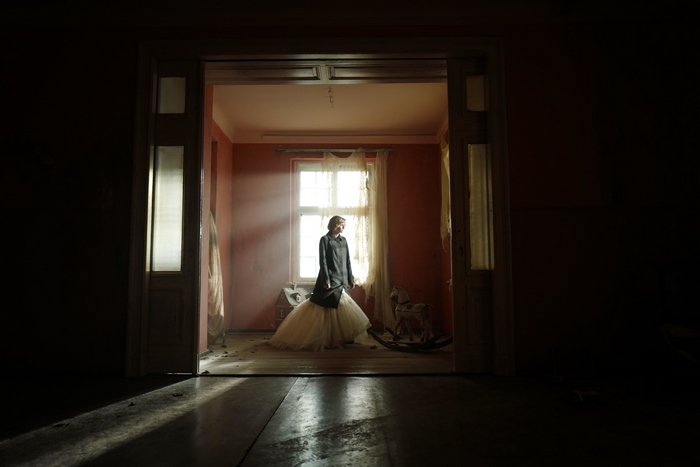Spencer: Kristen Stewart in a dramatic, sunlit room