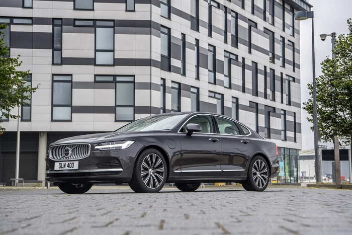 Luxury Volvo S90 T8 AWD by modern building 4K